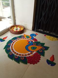 a decorated floor with flowers and peacocks on it