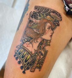 a woman's arm with a tattoo on it that has an image of a woman