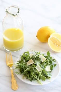 salad dressings for summer with lemon and parmesan cheese on the plate next to it