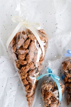 two bags filled with cookies sitting on top of a table