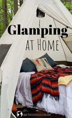 a tent with the words glamping at home on it and an image of a bed