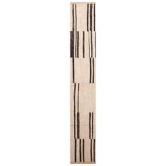 a tall white and black striped rug