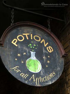 a sign hanging from the side of a brick building that says potions for all africons