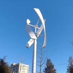 a large metal sculpture in the middle of a park