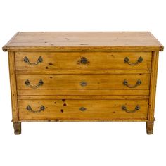 an old wooden dresser with two drawers on one side and three pulls on the other