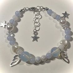 cute beaded bracelet with blue beads and angel wings Fairy Bracelet, Fairy Bracelets, Pastel Bracelet, Pretty Jewelry Necklaces, Bracelets Design, Y2k Fairy, Beads Bracelet Design, Jewelry Accessories Ideas, A Bracelet