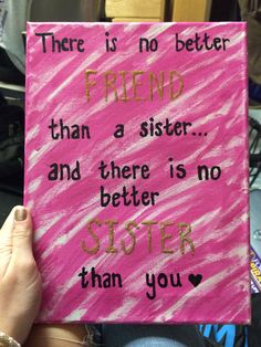 someone holding up a pink sign that says, there is no better friend than a sister and there is no better sister than you