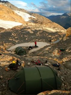 tents set up on the side of a mountain