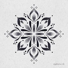 a black and white snowflake design on a gray paper with dots in the middle