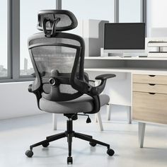 an office chair sitting in front of a computer desk