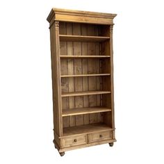 an old wooden bookcase with drawers