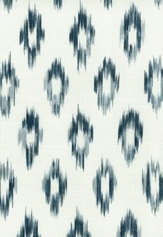 a white and blue pattern on fabric