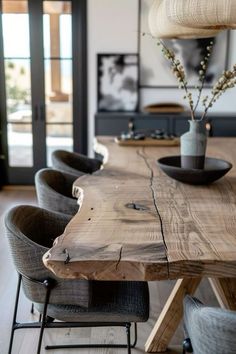 a wooden table with chairs around it