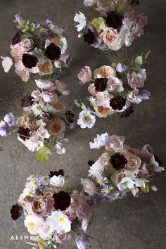 an overhead view of many different flowers in vases