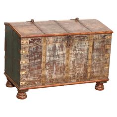 an old wooden chest with metal handles