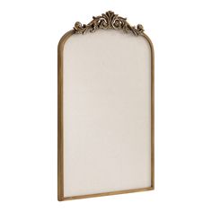 an ornate gold frame with white linen on the top and bottom, against a white background