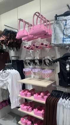 there is a display in the store with pink and black items