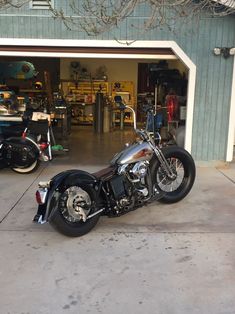 a motorcycle parked in front of a garage