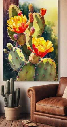 a cactus with yellow and red flowers in a room next to a brown leather chair