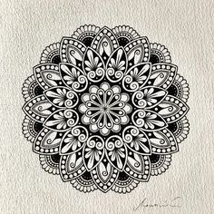 a black and white drawing of a flower