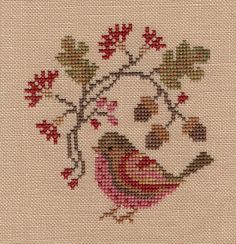 a cross stitch pattern with a bird on it's head and flowers in the background