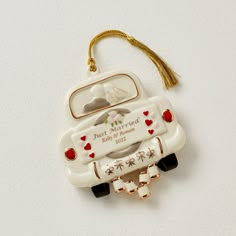 a ceramic ornament with a wedding car on it