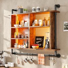 a shelf with pots and pans hanging from it's sides in a kitchen