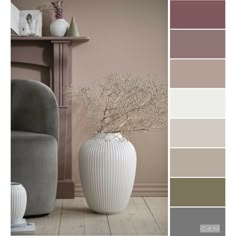 a vase with flowers in it sitting next to a gray chair and wall color swatches