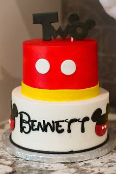 a mickey mouse birthday cake with the number two on top