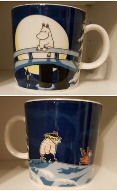 two mugs with pictures of animals on them, one is blue and the other is white