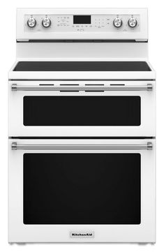 two white ovens side by side on a white background