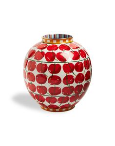 a red and white vase with cherries painted on the outside, sitting against a white background