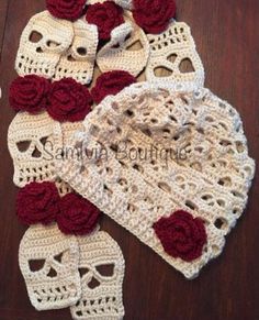 crocheted skull and rose dishcloths on wooden table