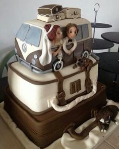 a cake made to look like a vw bus with people in it and luggage on top