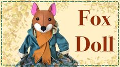 a stuffed animal with a scarf around it's neck and the words fox doll