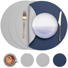 there is a plate, fork and knife on the table with other items around it