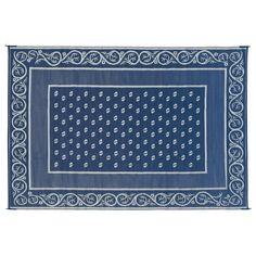 a blue and white rug with an intricate design on the bottom, in front of a white background