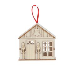 a white christmas ornament with a red ribbon hanging from it