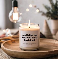 a candle that reads smells like my traditional book, boy friend on the front and side