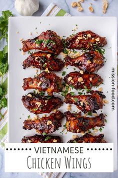 vietnamese chicken wings on a white plate