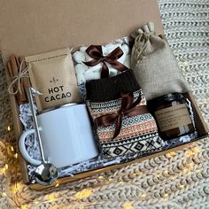 a gift box with coffee, hot chocolates, marshmallows and cinnamon sticks