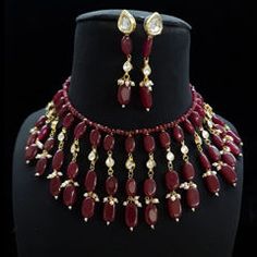 Gold Rodium Polish Red and Maroon color Necklace in Metal Alloy studded with Kundan, Pearl Luxury Ruby Kundan Necklace For Formal Occasions, Red Ruby Choker Jewelry, Red Ruby Choker Necklace, Red Choker Bridal Necklace For Celebration, Red Bridal Choker Necklace For Celebration, Red Kundan Choker Necklace For Celebration, Red Jewelry Sets For Celebration, Red Choker Jewelry Sets For Festivals, Festive Red Choker Jewelry