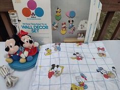 the mickey mouse and minnie mouse baby bedding set is next to it's box