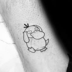 a black and white photo of a penguin tattoo on the ankle, with an arrow in it's beak