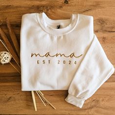 This custom Mama est 2024 Sweatshirt is the perfect gift for Mother's Day. Also great for a Pregnancy Announcement. Each Sweatshirt is printed on order with love ❤ This Sweatshirt essential fits like a well-loved favorite. Super soft cotton and excellent quality print makes one to fall in love with it over and over again. Size chart available in photo. Material: 50% Cotton, 50% Polyester Any questions? Just ask :) Want to personalise something? Just drop me a line... Personalised Mothers Day Gift, Mom Pregnancy Announcement, Custom Embroidered Sweatshirt, Mother Daughter Matching Outfits, Moms Day, Mama Sweater, Mama Hoodie, Cute Shirt Designs, Mama Gifts