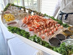 a buffet with seafood and other foods on it