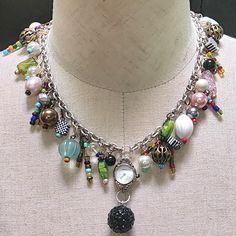 This Uniquely Assembled Necklace Features Assorted Vintage Beads and A Vintage Watch (not operating) and Black Glitter Bead.  The Silver 22" Chain Can Be Shortened Upon Request at No Charge. This Versatile Necklace Will Be A Perfect Accessory For You Or Your Special Someone.  FREE STANDARD SHIPPING WITHIN THE U.S Collage Jewelry, Jewelry Colorful, Assemblage Necklace, Colorful Necklace, Vintage Beads, Jewelry Beaded, Upcycled Jewelry, Jewelry Unique, Black Glitter