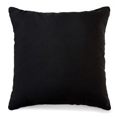 a black pillow on a white background with no one in the photo to describe it