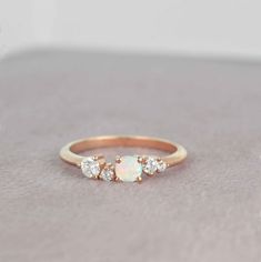 an opal and diamond three stone ring