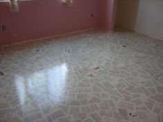 an empty room with pink walls and white tile flooring in the center is a window that has no curtains on it